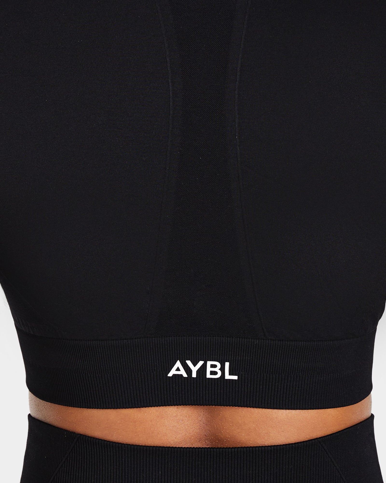 Haut court à manches longues sans couture Empower - Noir